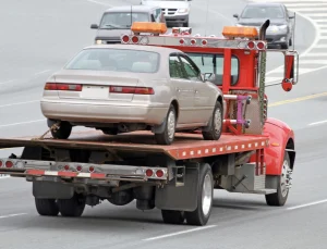 Flatbed Towing 2 flatbed tow truck with brown car